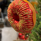 Doughnut rød med gull Filipiniana